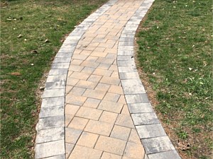 nicolock adobe blend walkway with granity city border herringbone